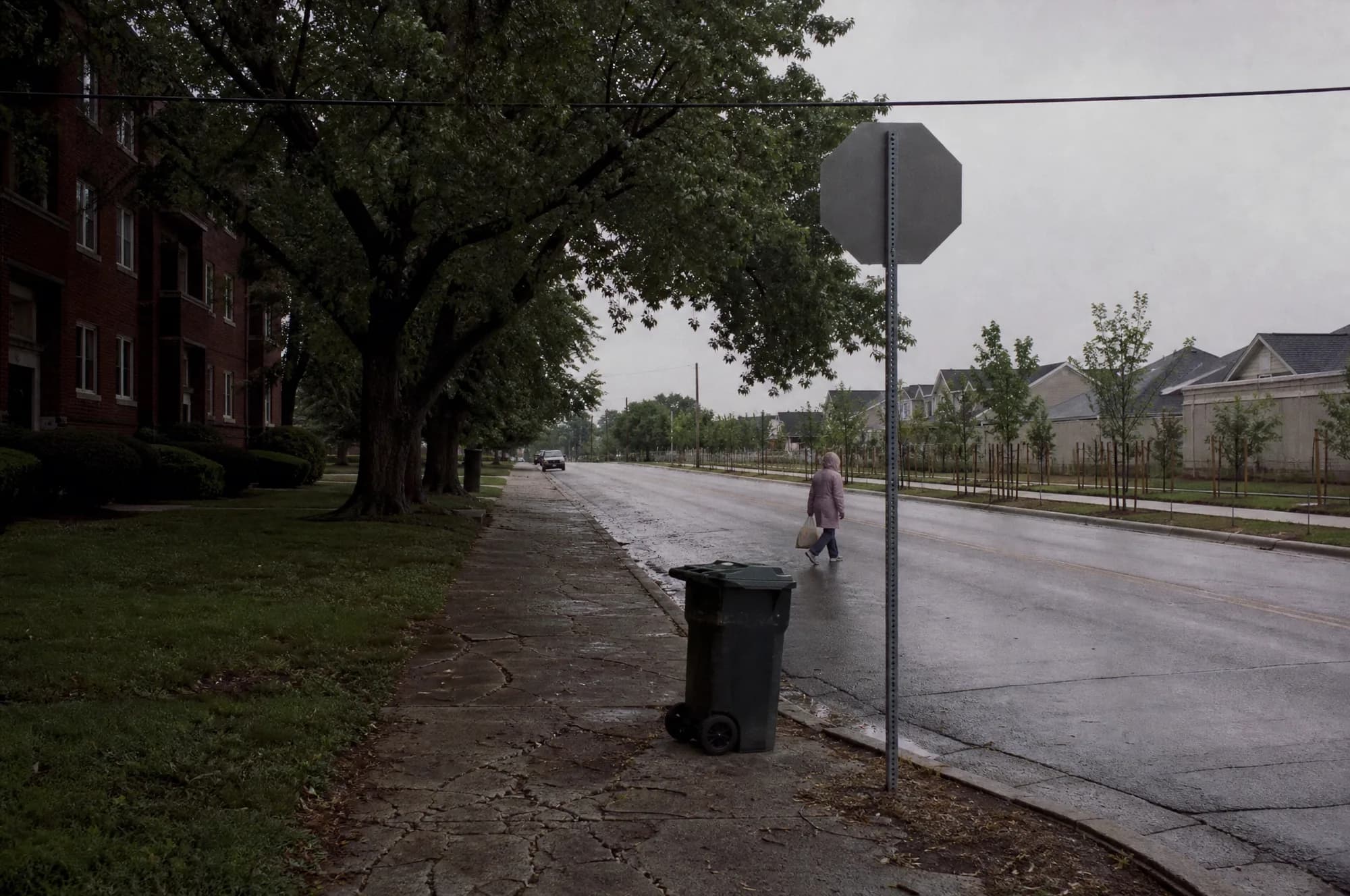 An ordinary Kansas City street on an overcast afternoon — no golden hour, no filter. This is the flat, honest light the city is under for a good part of the year, and it is the light you should judge it in.